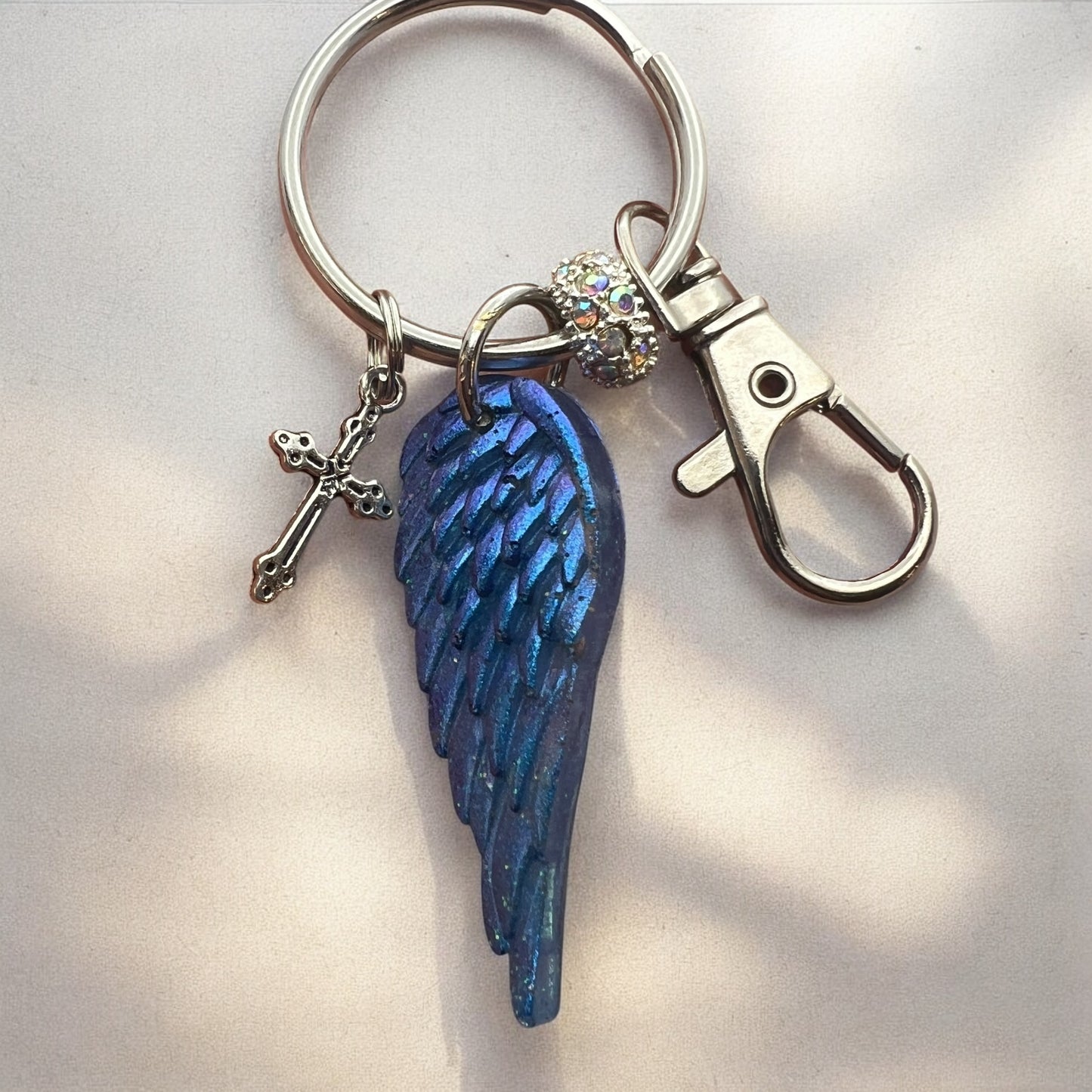 Blue Resin Angel Wing Keychain with Cross Charm and Rhinestone Bead