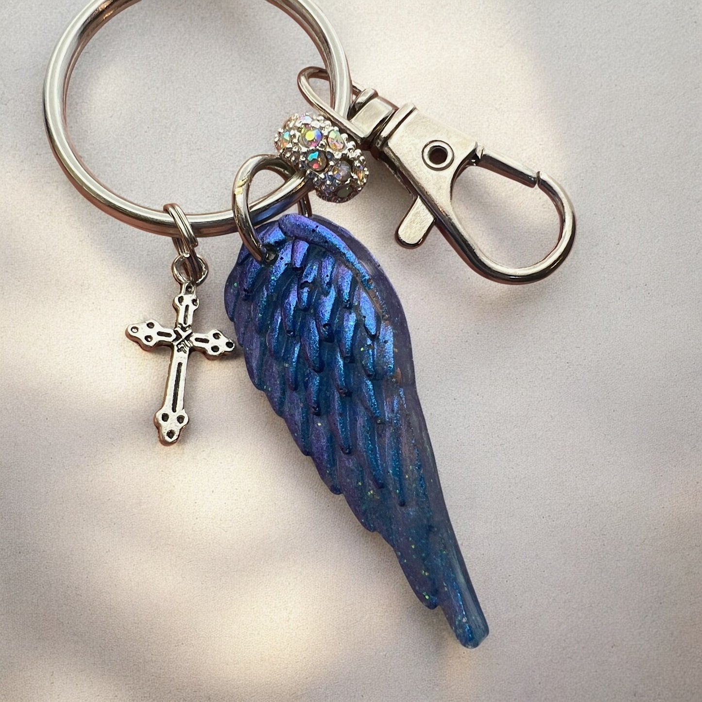 Blue Resin Angel Wing Keychain with Cross Charm and Rhinestone Bead – Inspirational Bag Charm, Purse Accessory, Memorial Gift for Her