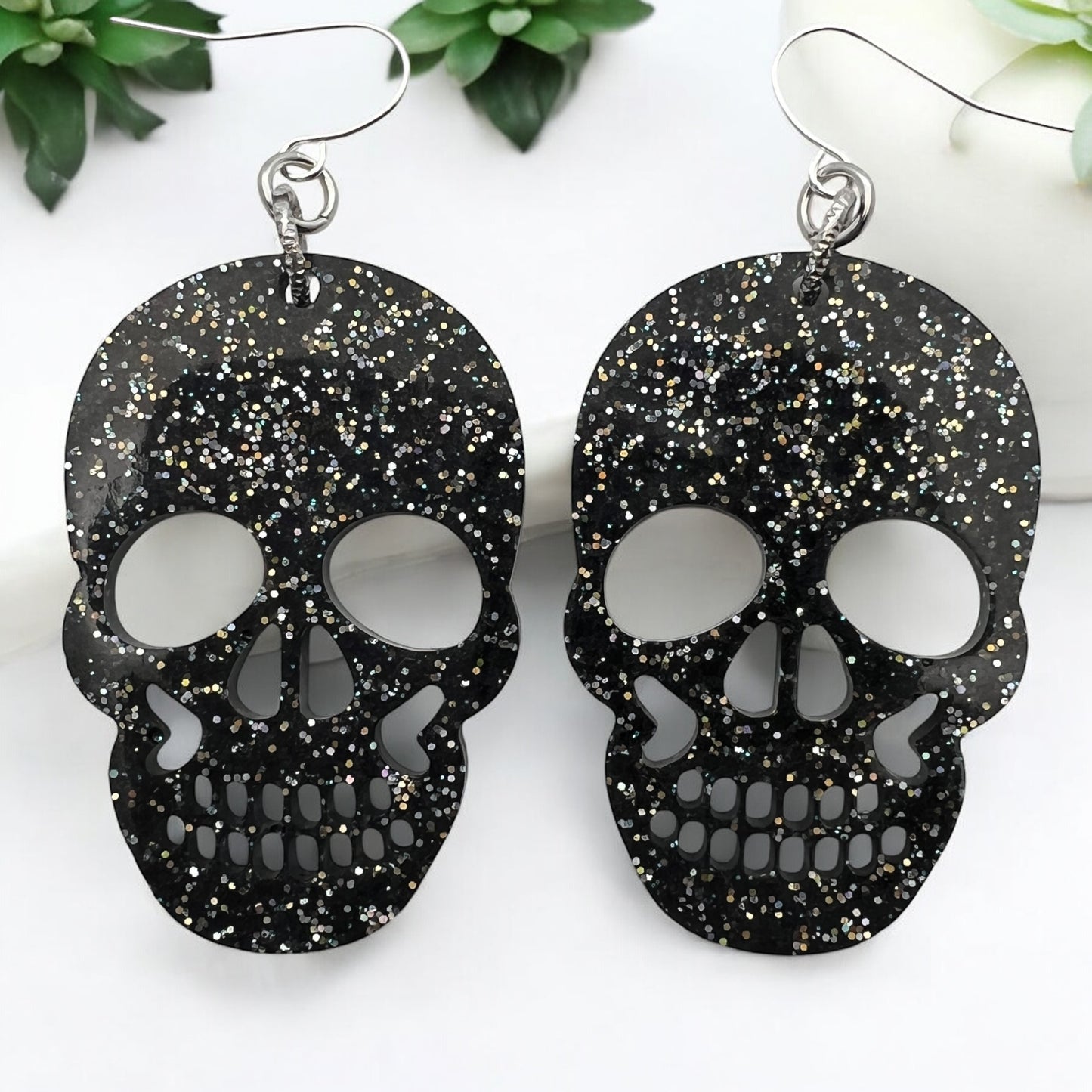 Black Resin Glitter Skull 2” Earrings