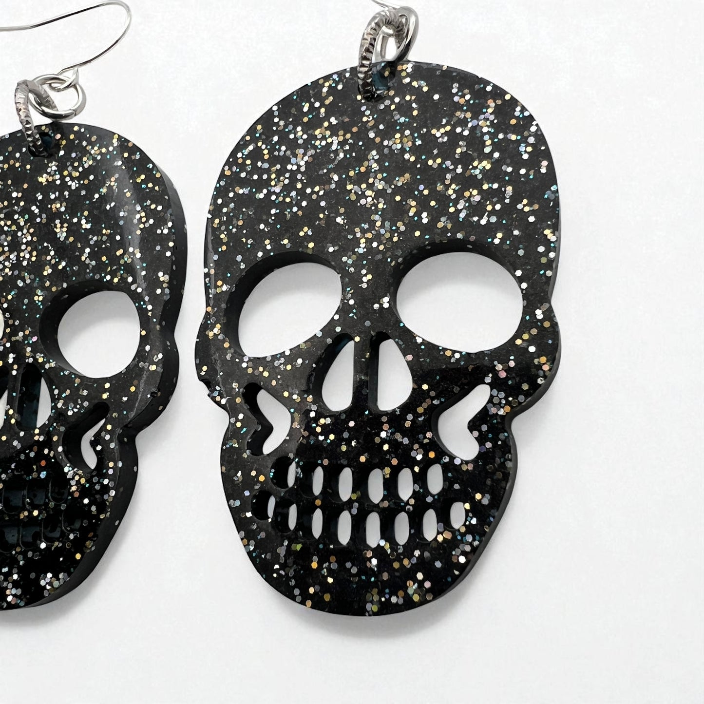 Black Resin Glitter Skull 2” Earrings