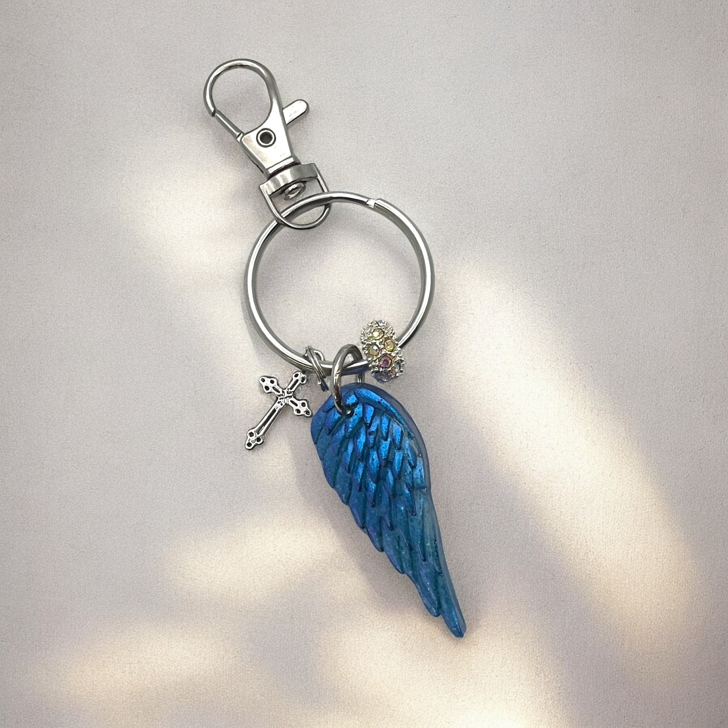 Blue Resin Angel Wing Keychain with Cross Charm and Rhinestone Bead