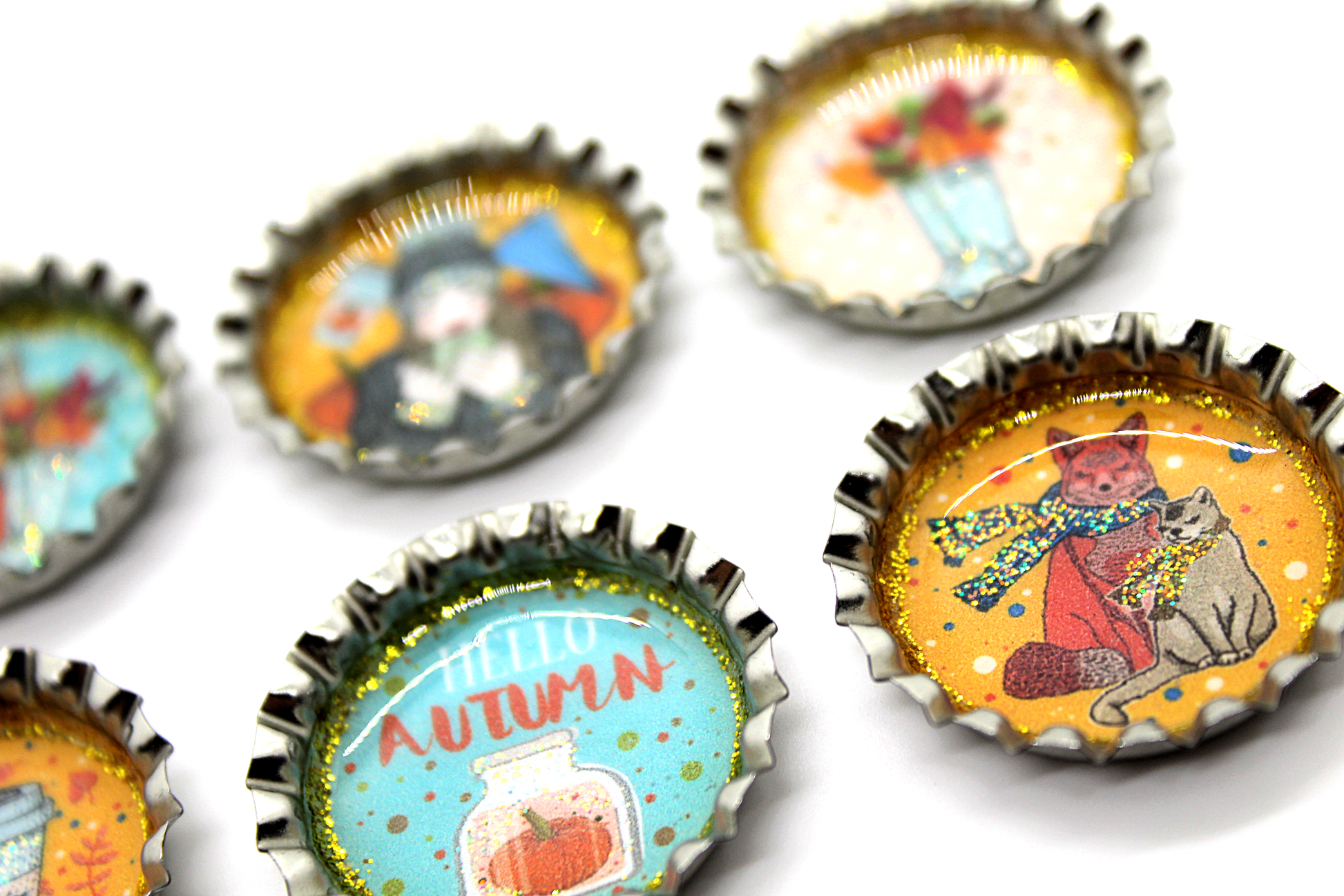 Set of 6 Bottle Cap Autumn Theme Magnet Set in colors of orange, brown and turquoise featuring cats, pumpkins, pumpkin spice, scarves and a woman in a cozy sweater